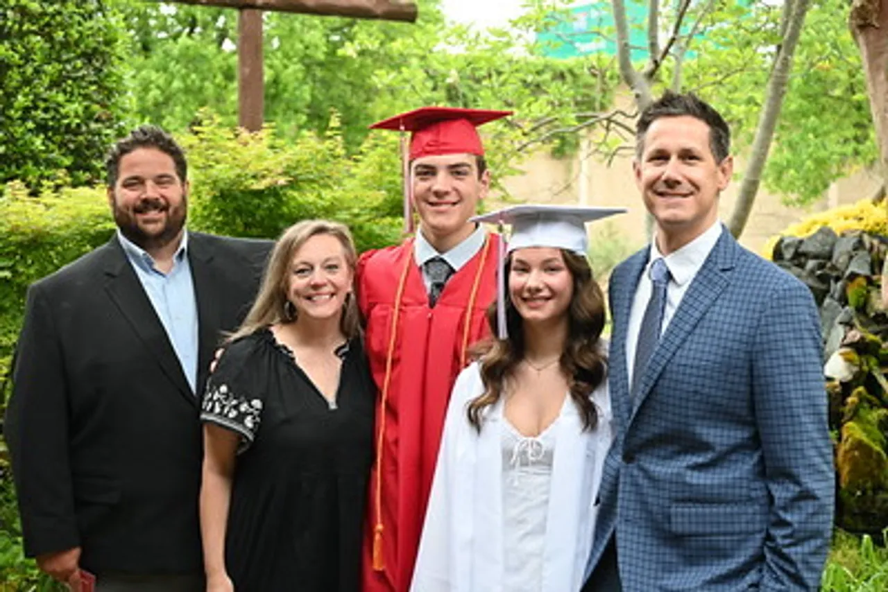 Alumni and their legacies pose for photo before graduation