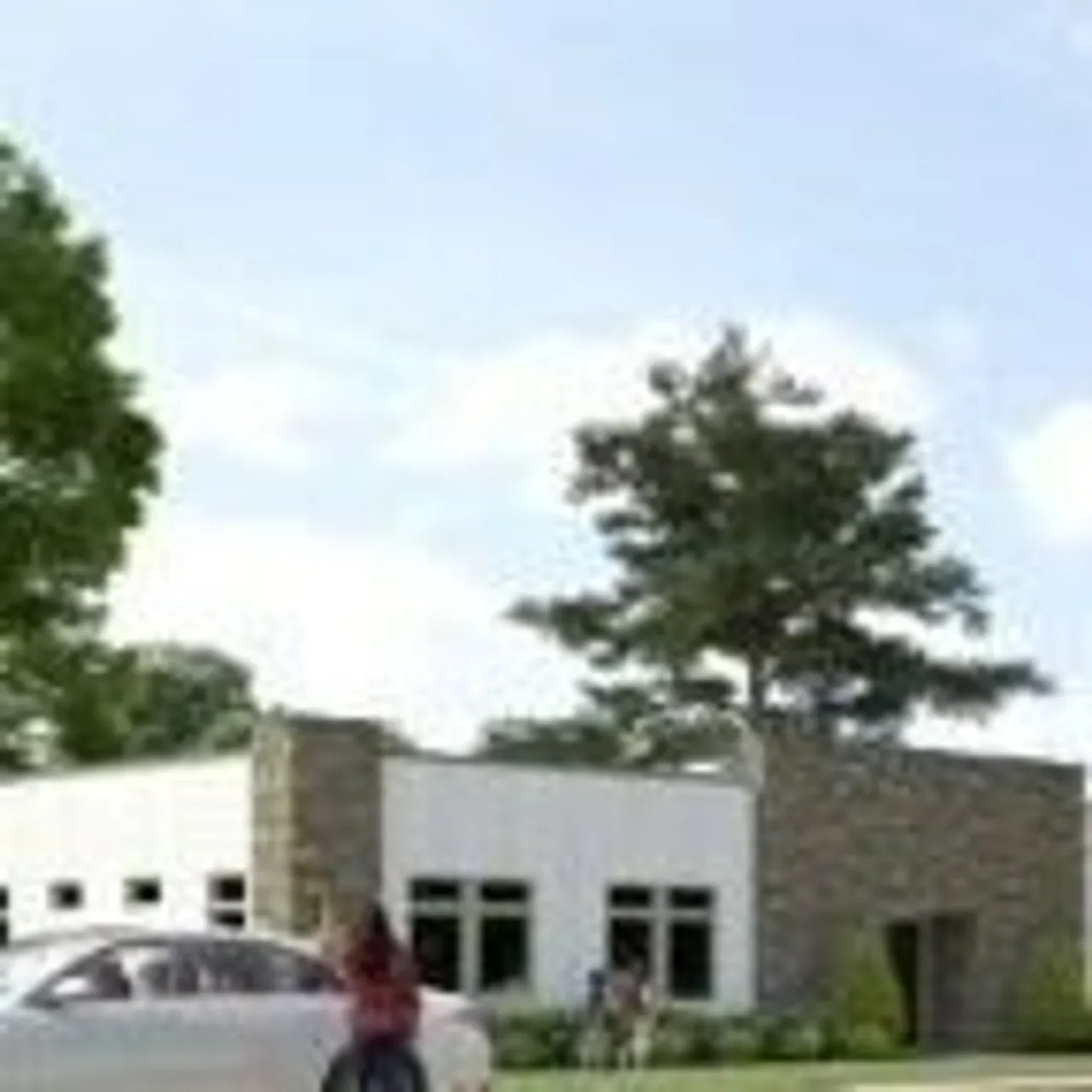 Rendering of the new classroom wing with building and trees at the front of the school