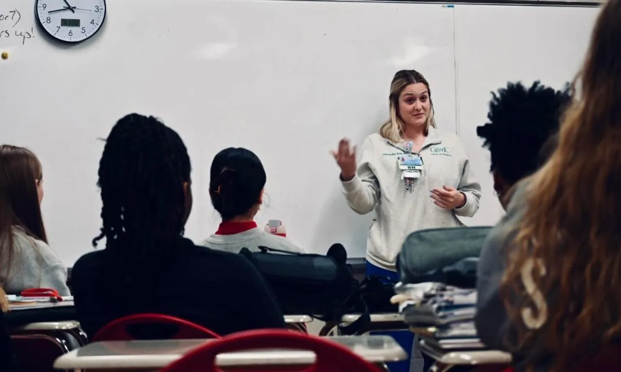 Nurse speaking with students in the classroom.