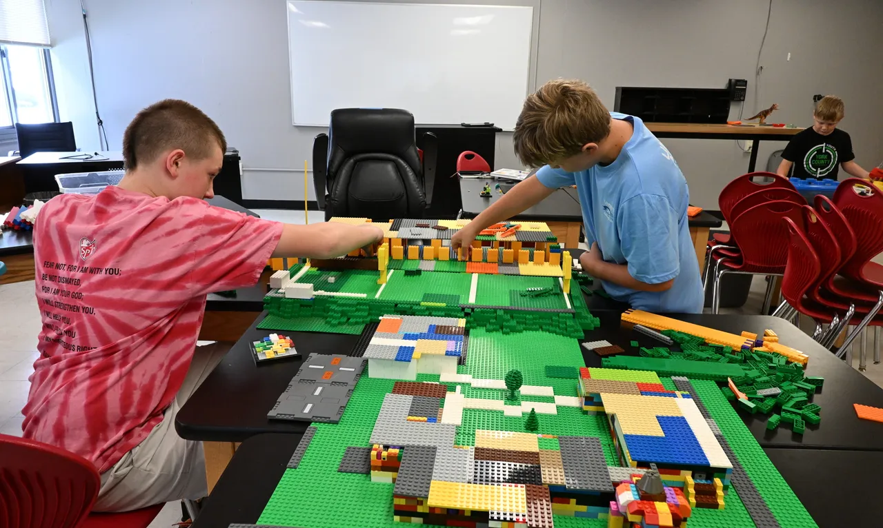Campers building the Concordia Prep campus with building blocks during Lego Camp.
