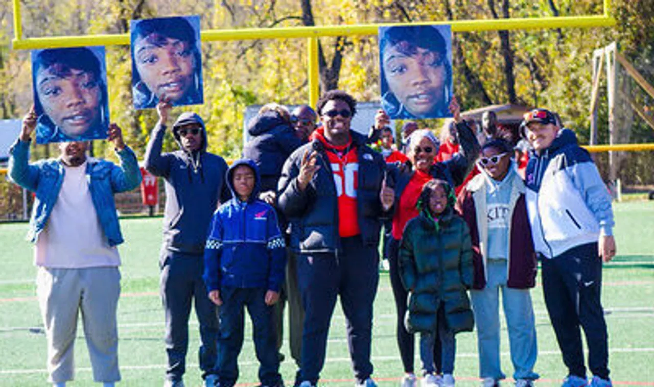 Rodney White (center) surrounded by family and friends during his senior football game recognition ceremony in the fall.