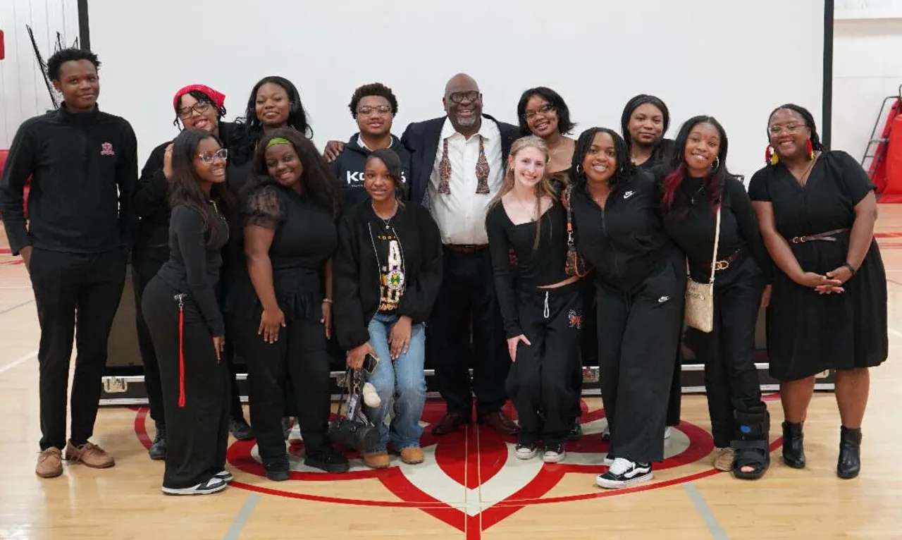 Students posing for photo after a student-led assembly.