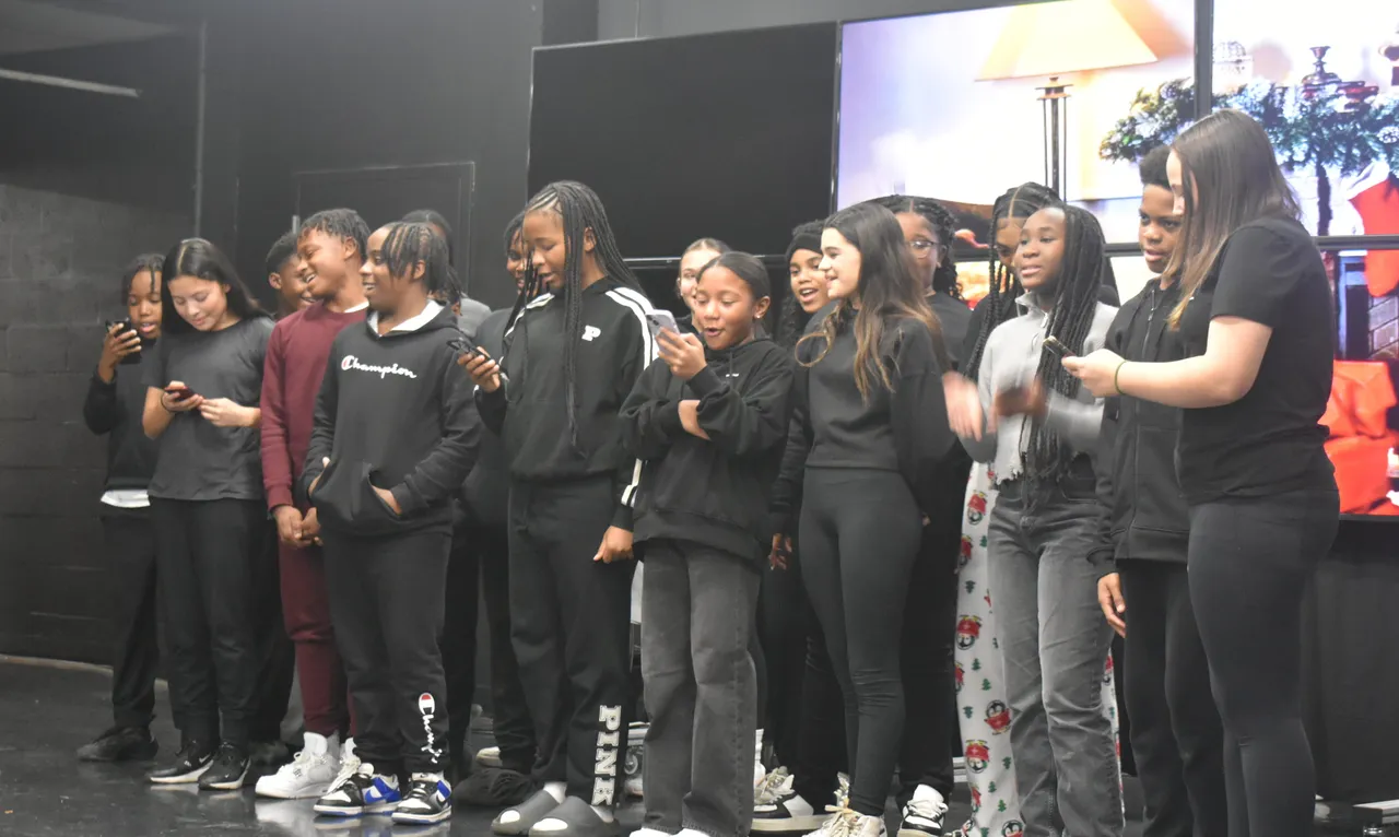 Students reciting one act plays in front of audience