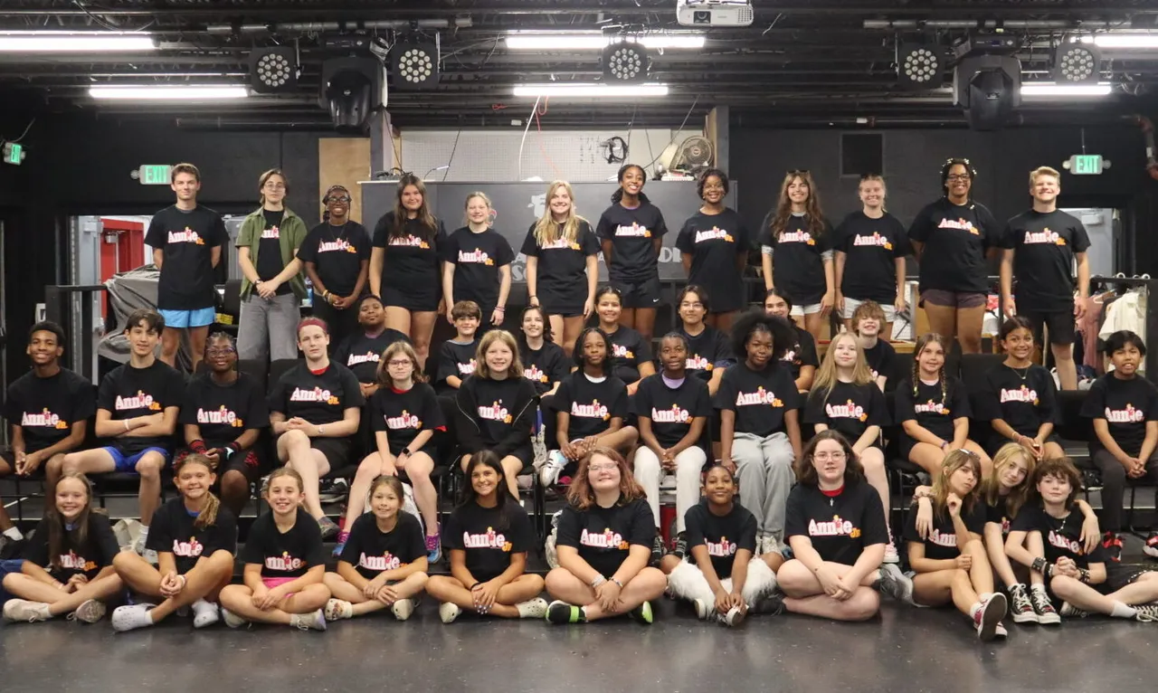 Group of campers and leaders posing for photo during camp.