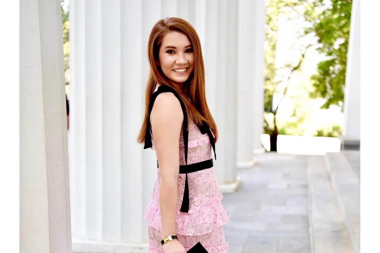 Female alumna pictured outdoors.