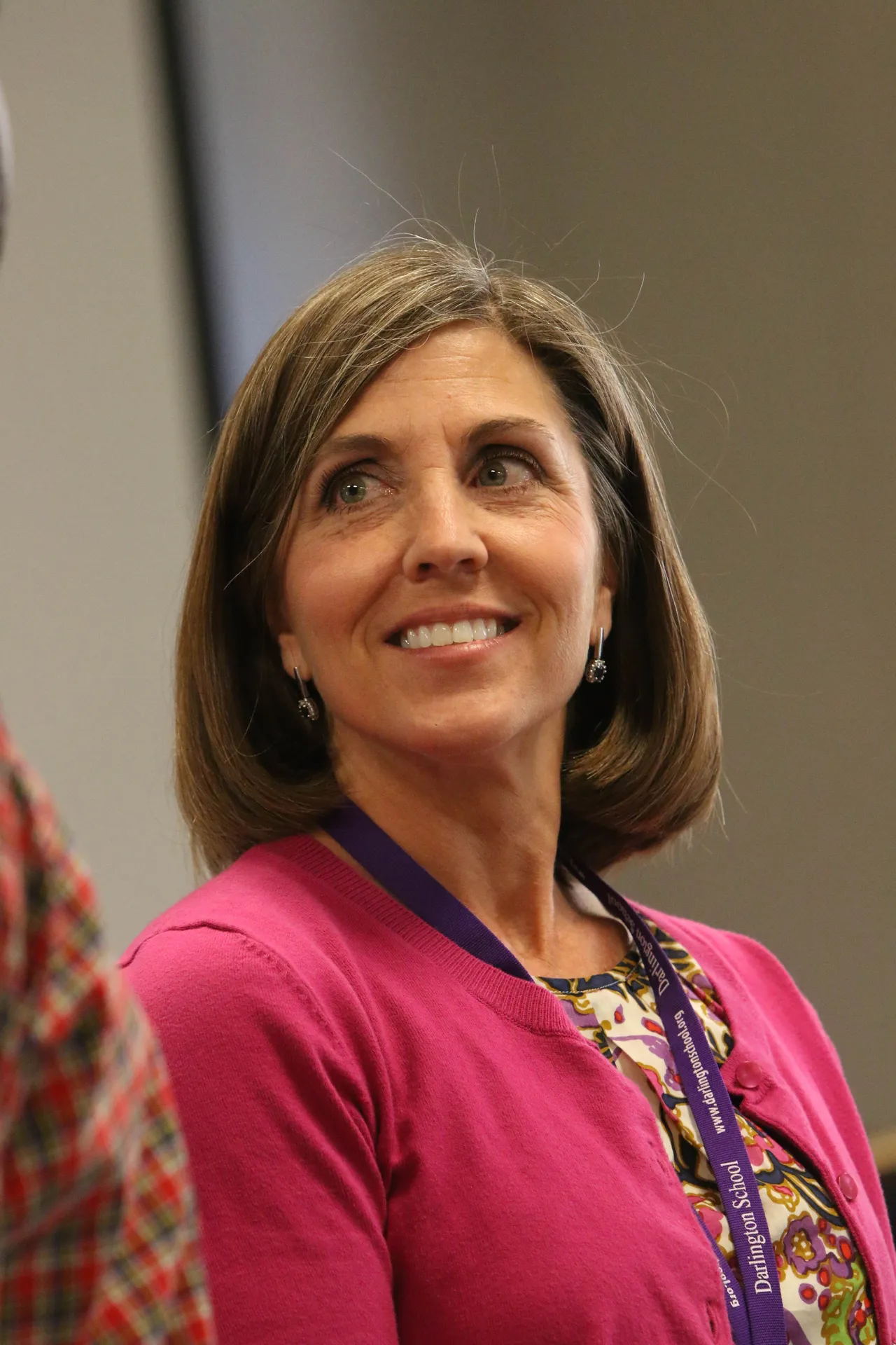 Female alumna pictured indoors.