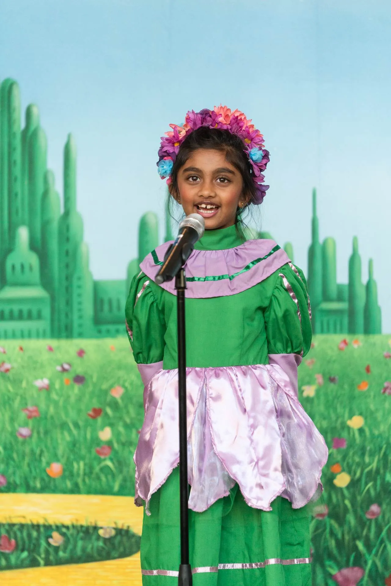 Female primary grades student performs in a class play