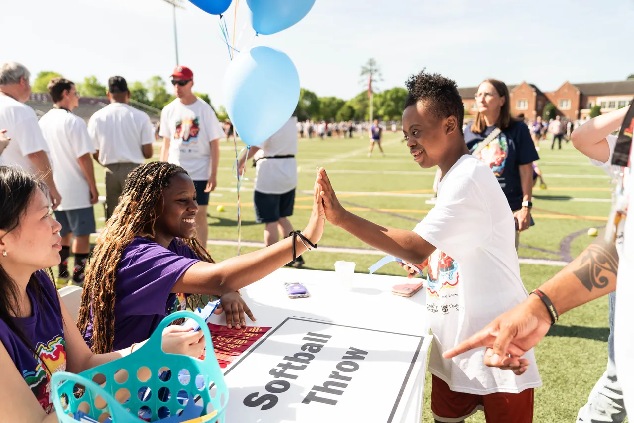 Ninth-grade students volunteer at the Special Olympics Softball Throw station for the Freshman Class Service Project