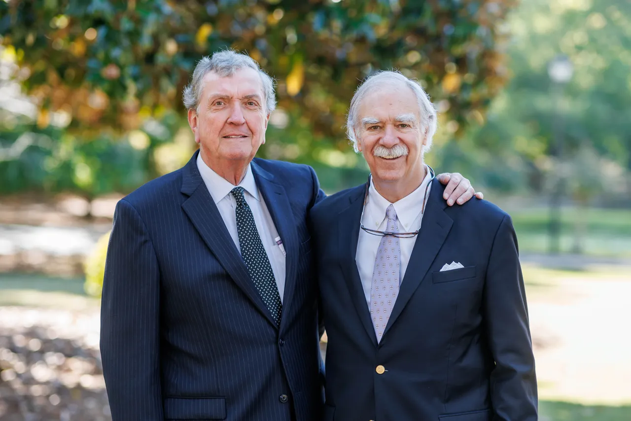 Darlington School Distinguished Alumnus Larry Williams pictured with his best friend and former roommate by the lake.