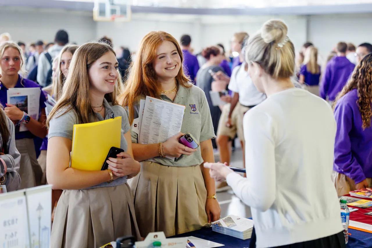 High school students talk to a college representative at Darlington School's annual college fair