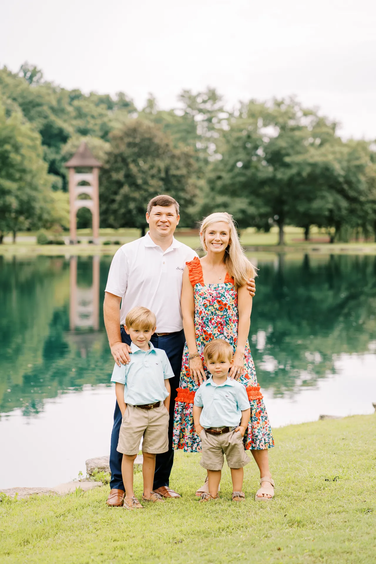 Husband and wife pictured on campus with their two young male children who are students