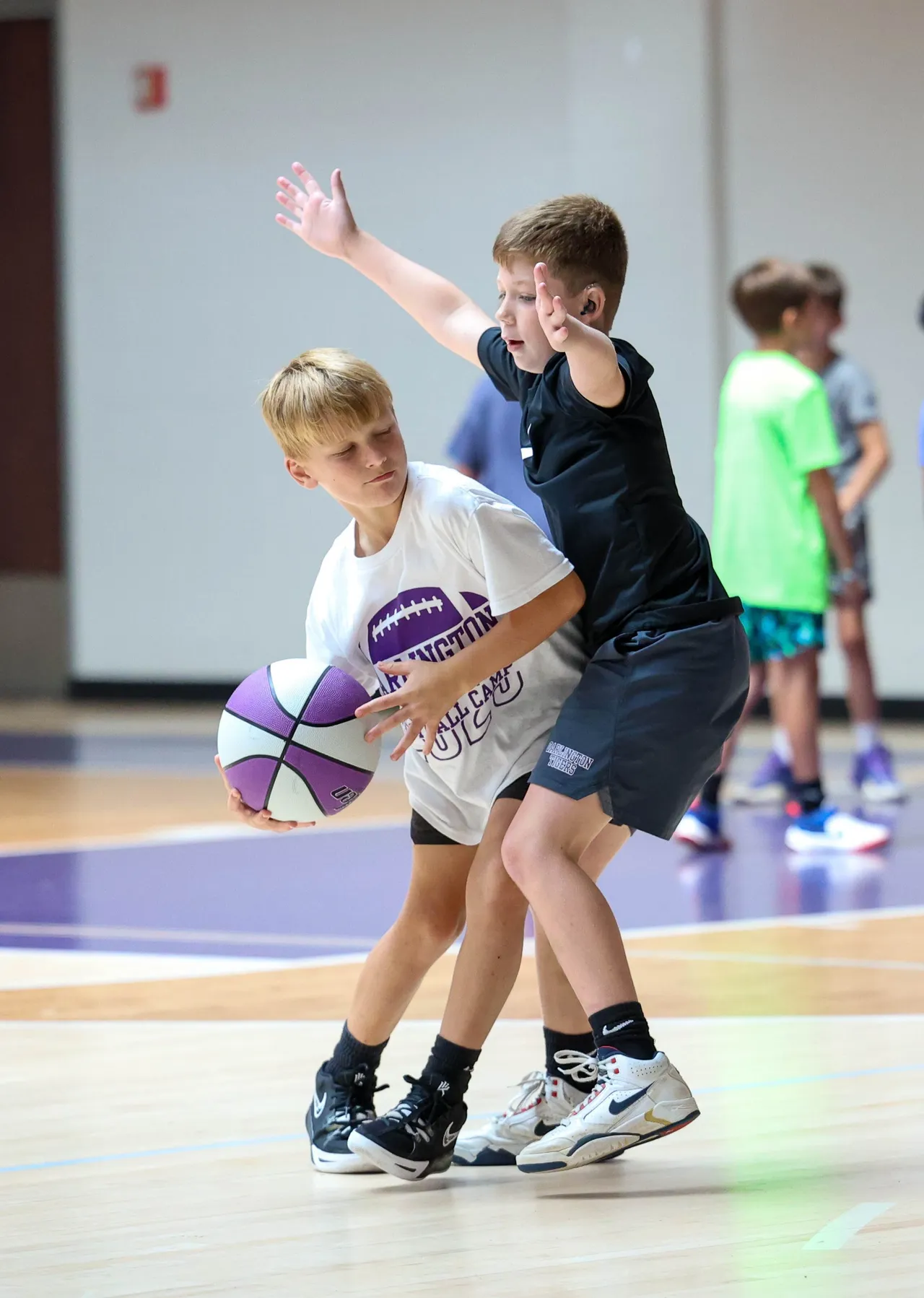 Young male campers practice basketball during Darlington School's Youth Boys' Basketball Camp.