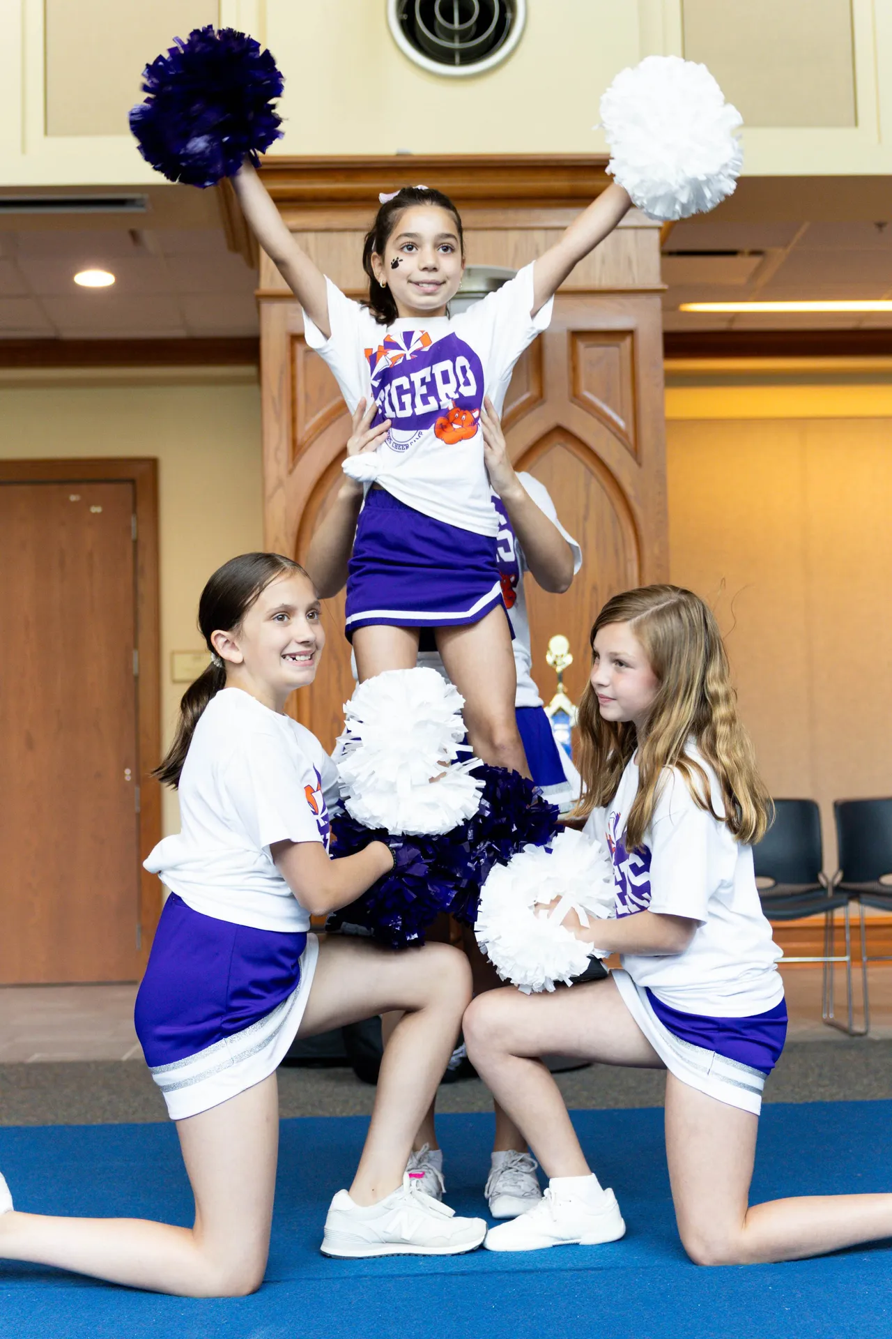 Female campers perform a cheer stunt during Darlington School's Cheer Camp.