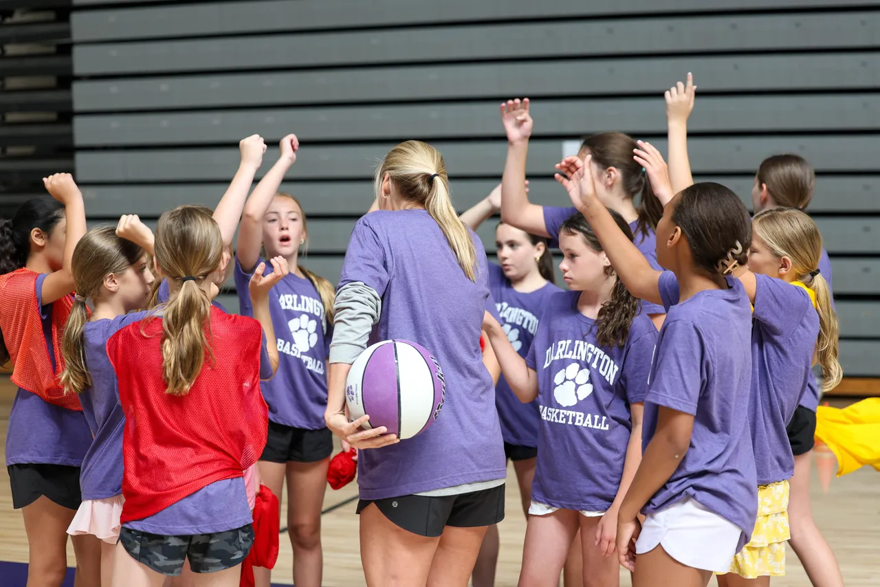 Female campers gather in a team huddle during Darlington School's Girls Basketball Camp.