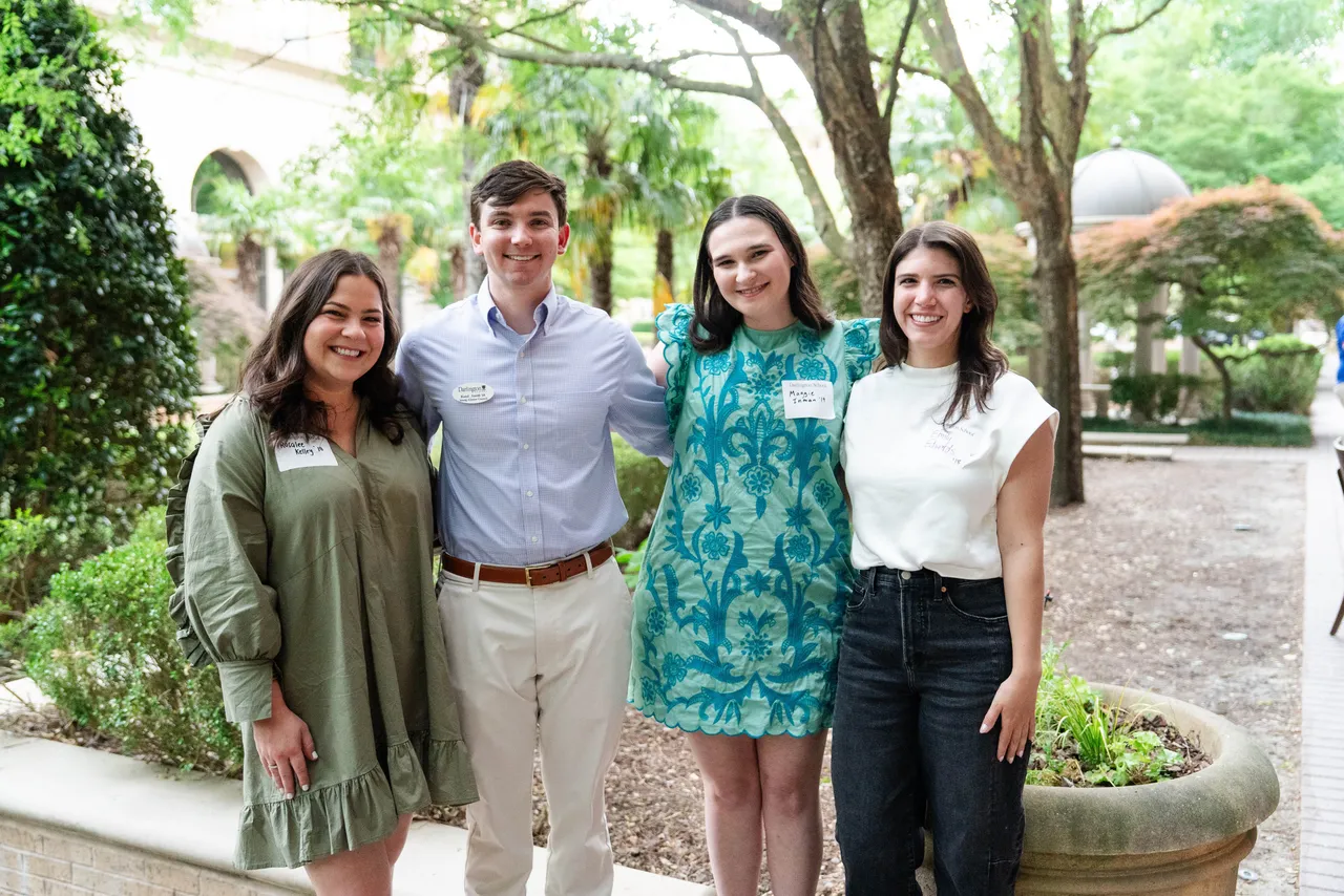 Male and female alumni pose together at a Darlington School alumni event.