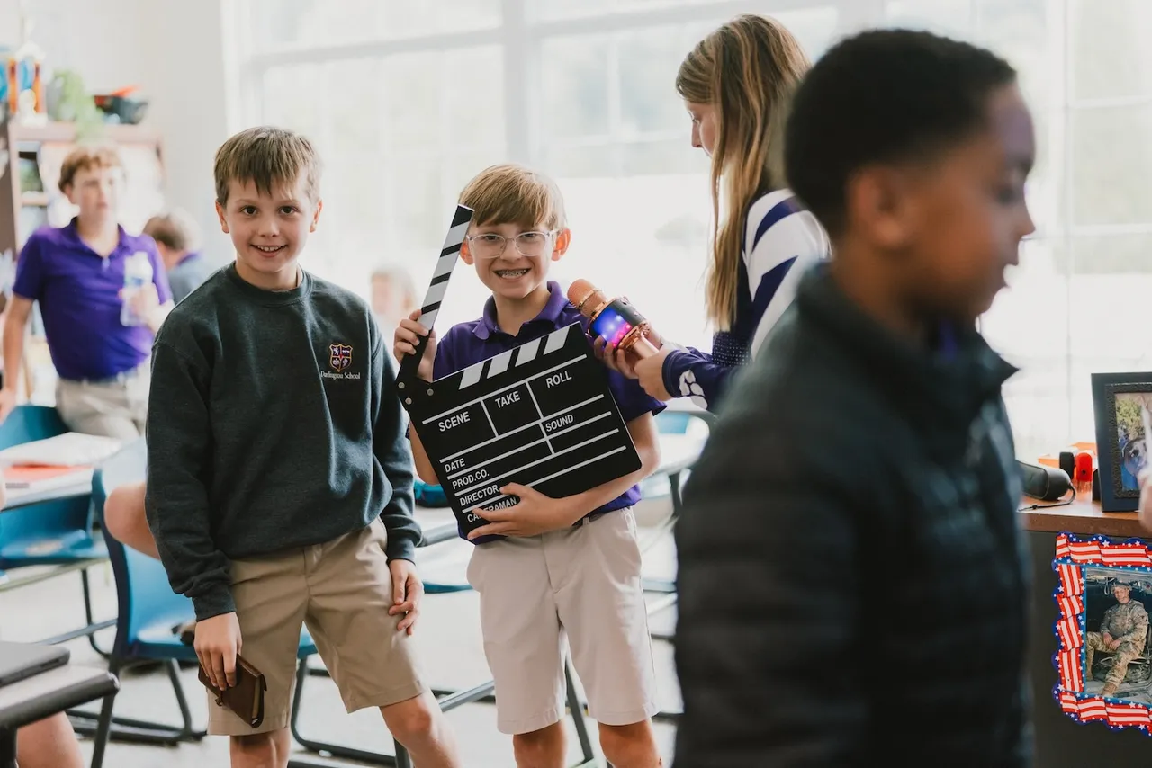 Lower grades students film presentations in their classroom, an example of active learning at Darlington