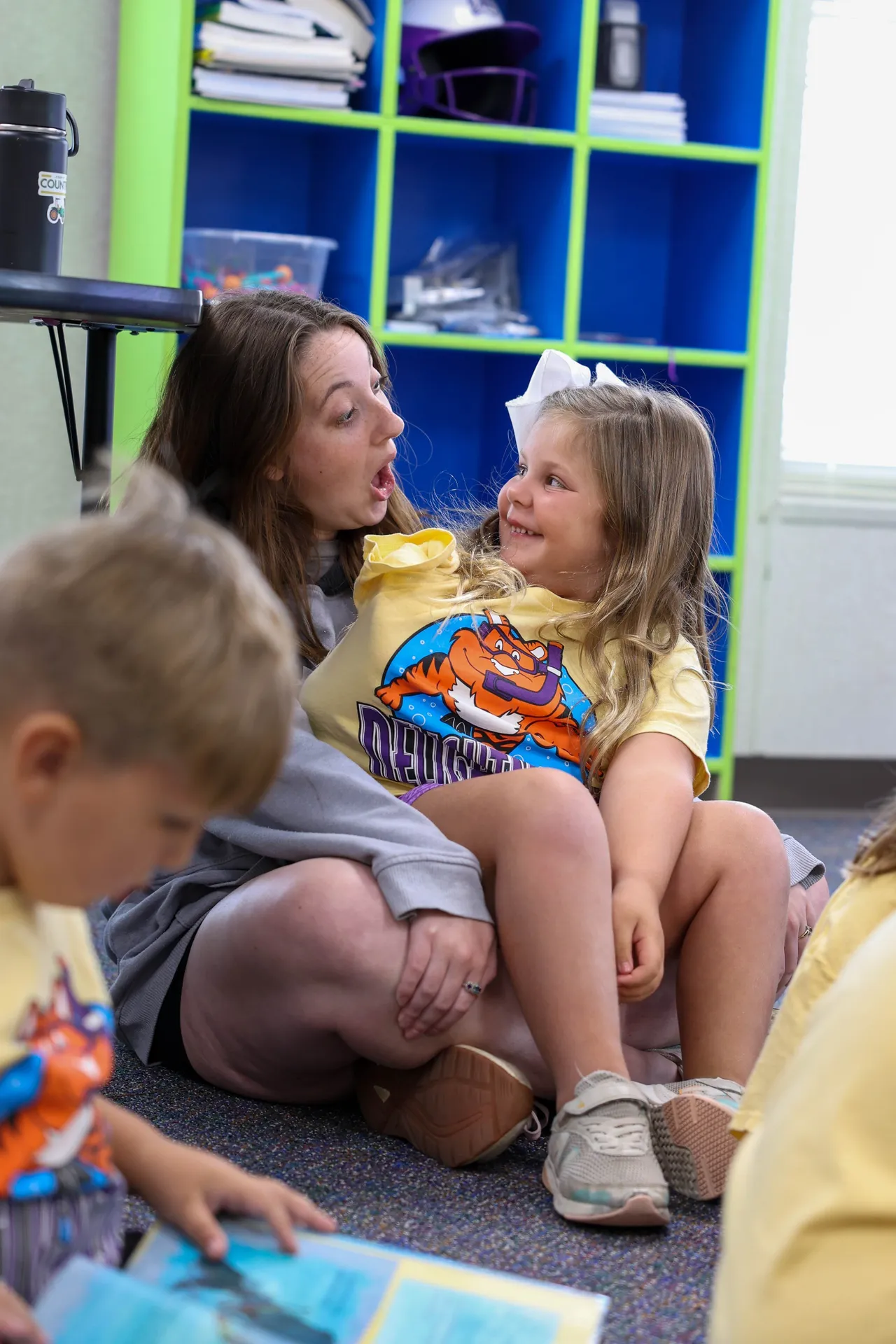 Female counselor interacts with a young female camper during Camp Delightascope.