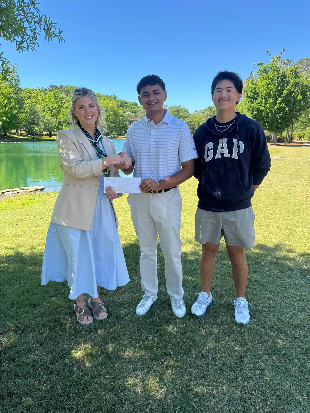 High school students present check to local nonprofit
