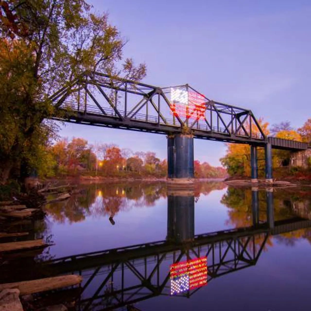 Robert Redden Footbridge lit up over the river in Downtown Rome, GA