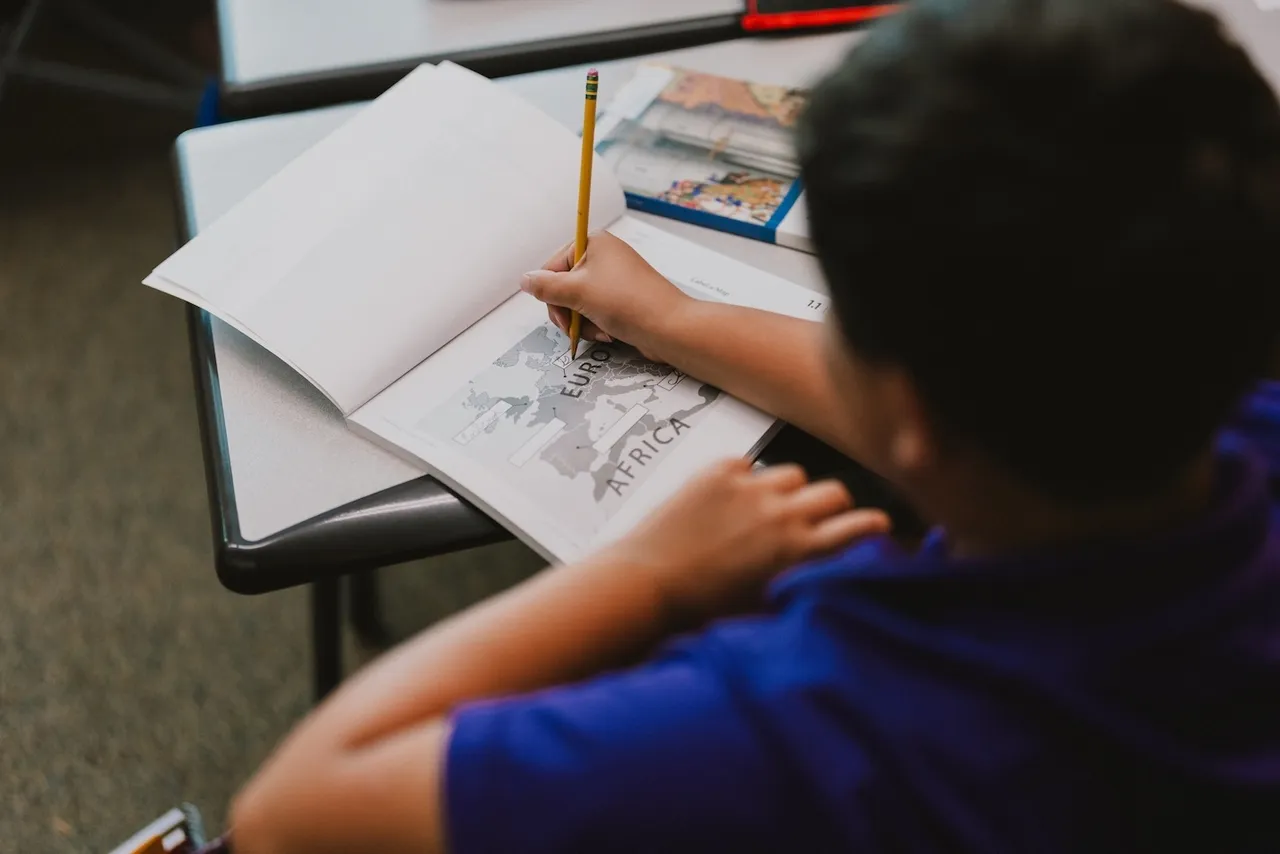 A female student works on a writing assignment