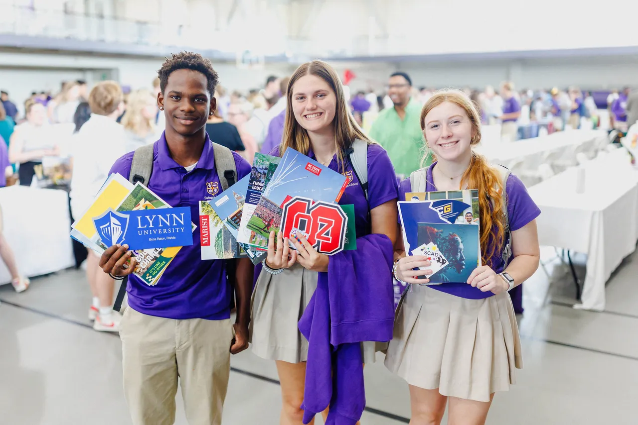 High school students gather marketing materials from hundreds of colleges and universities at Darlington's annual college fair