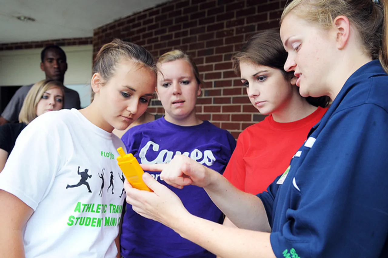 AthTrainingCamp1; Athletic trainer Katrina Worely shows (center lect to right) Katie Humphreys, Savannah Porter and Laura Rhoades and other students at Floyd Physical Therapy and Rehab's athletic training mini-camp how to take a wet bulb temperature with a digital sling psychrometer Wednesday afternoon during the camp held at Darlington. Athletic trainers use the psychrometer to help prevent dehydration and heat illnesses in athletes. Worley is an athletic trainer at Darlington School. Other Floyd trainers participating in the camp are Jay Mills from Rome High School, Matt Carnes from Woodland High School and Bo Bradshaw from Armuchee High School. (Photo/Lindy Dugger Cordell) LDC_6577 6-10-09