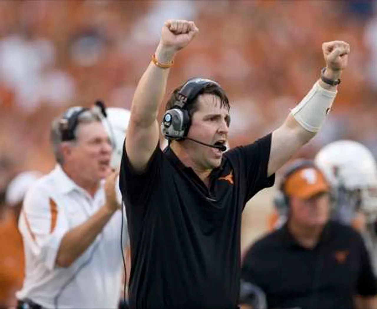 Texas defensive coordinator Will Muschamp cheers on the defense during the Texas win over Florida Atlantic this season in Austin, Texas.
