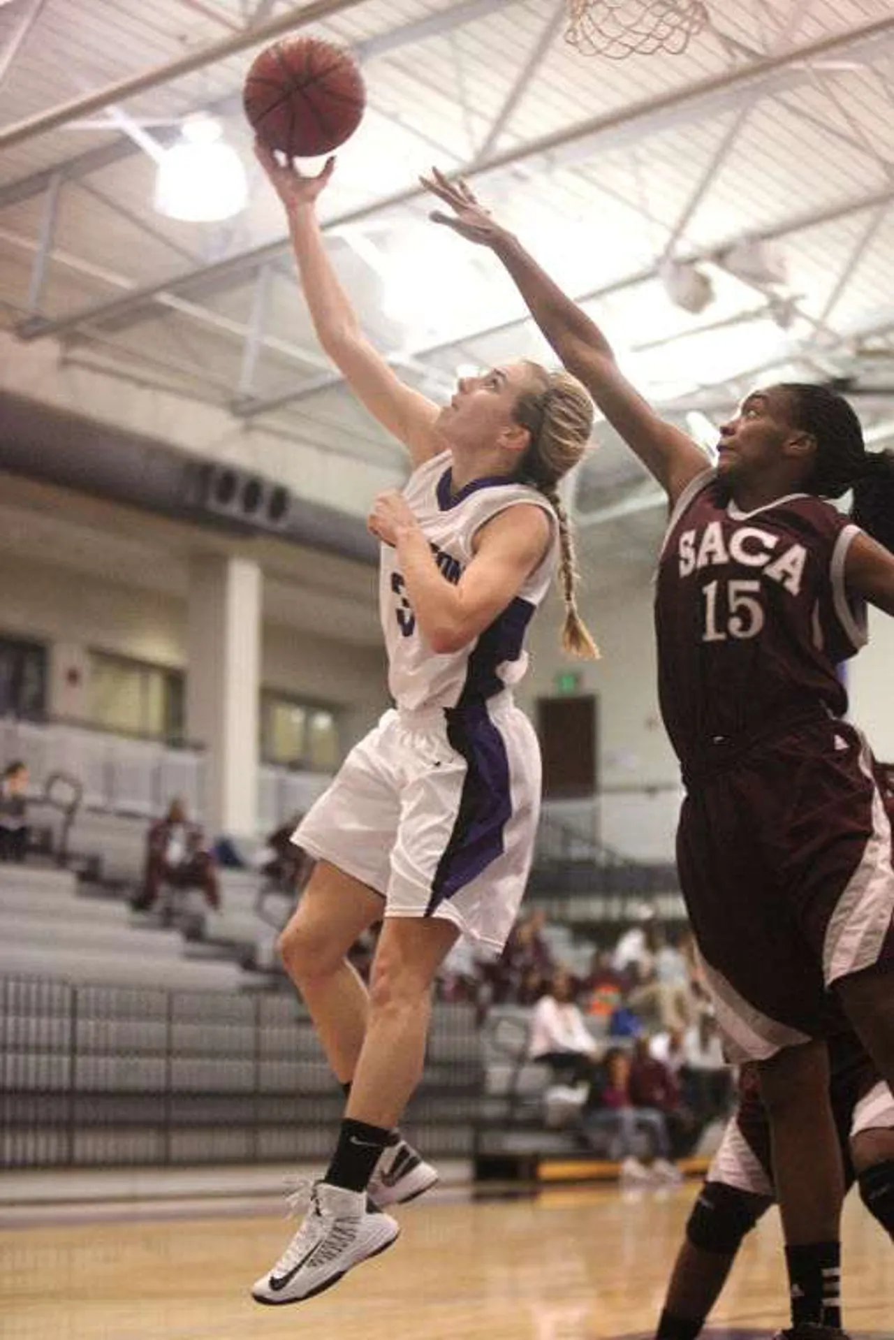 Darlington senior Bailey Brock (left) goes up for a layup against SACA senior Alexis Carter at the Huffman Athletic Center, January 15, 2013. (Brittany Hannah/RN-T)
