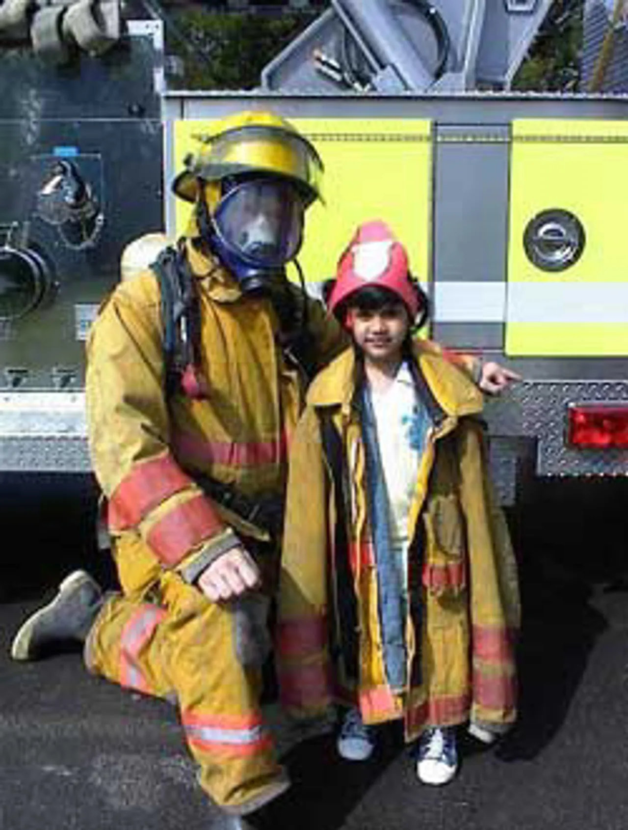A local fight figher visits the Lower School during pre-kindergartener's "F" week. Fire safety was one of the lessons associated with the letter lesson