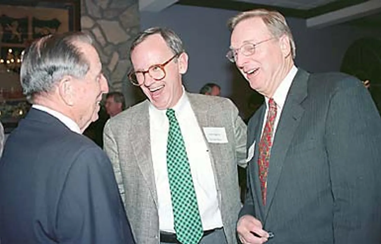 Board Chairman John Thatcher '44 and Board members Frank Stegall '62 and George Johnson '54, all members of the Presidential Search Committee which tapped Hicks, converse during the welcome dinner.