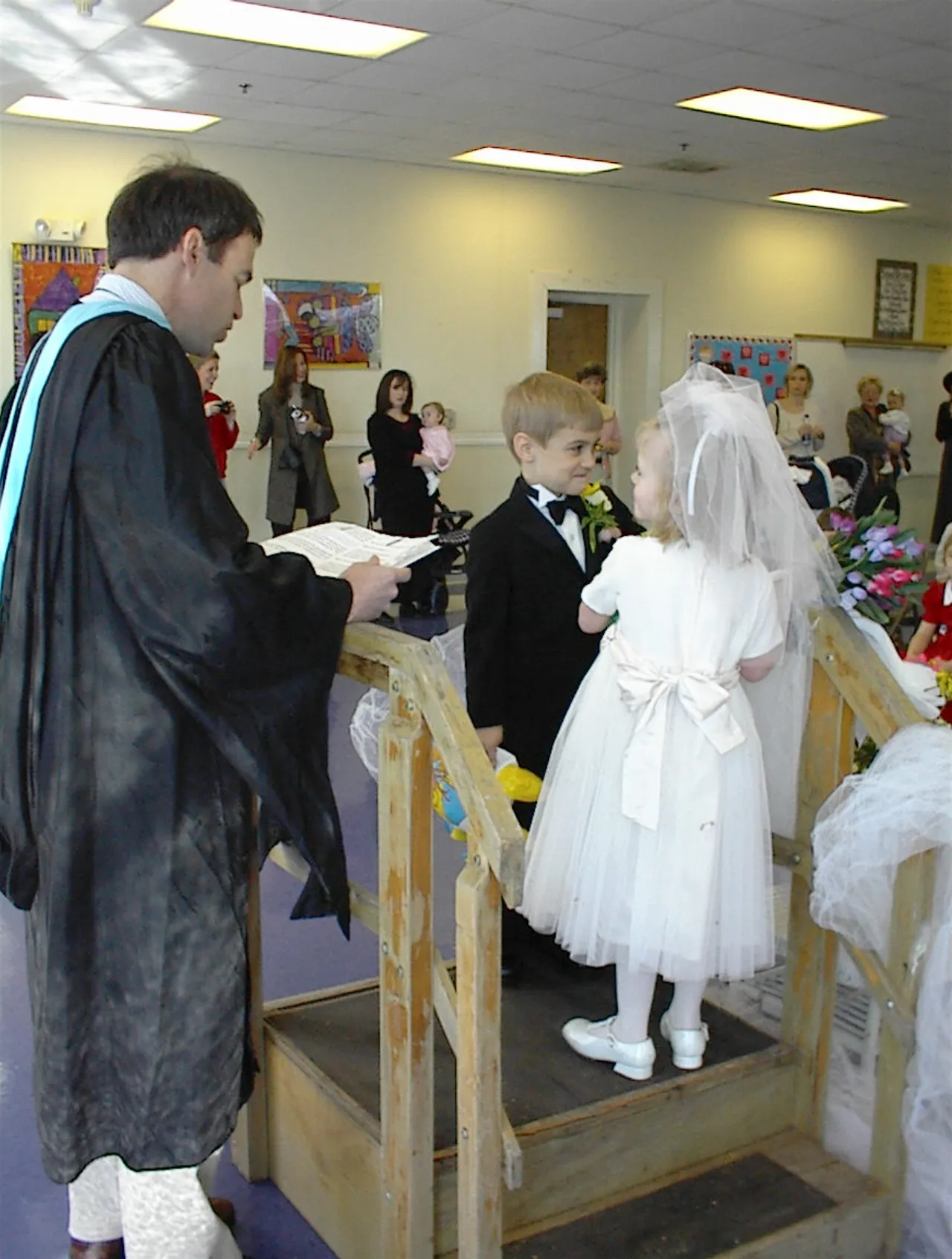 During a festive occasion, pre-kindergartners learn that the letters "Q" and "U" should stay together --just like a marriage.