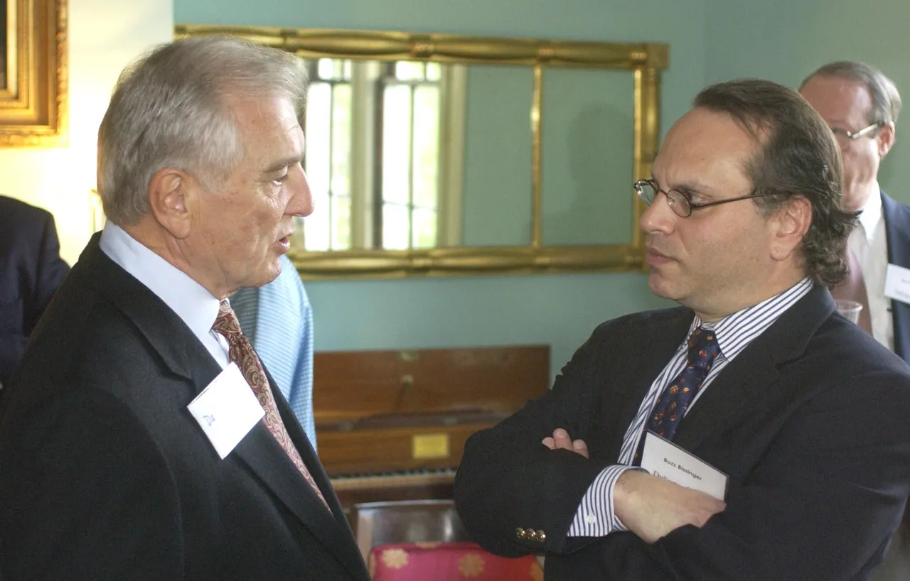 Bissinger visits with faculty and members of the Board of Trustees and Board of Visitors during a cocktail reception the evening prior to his talk.