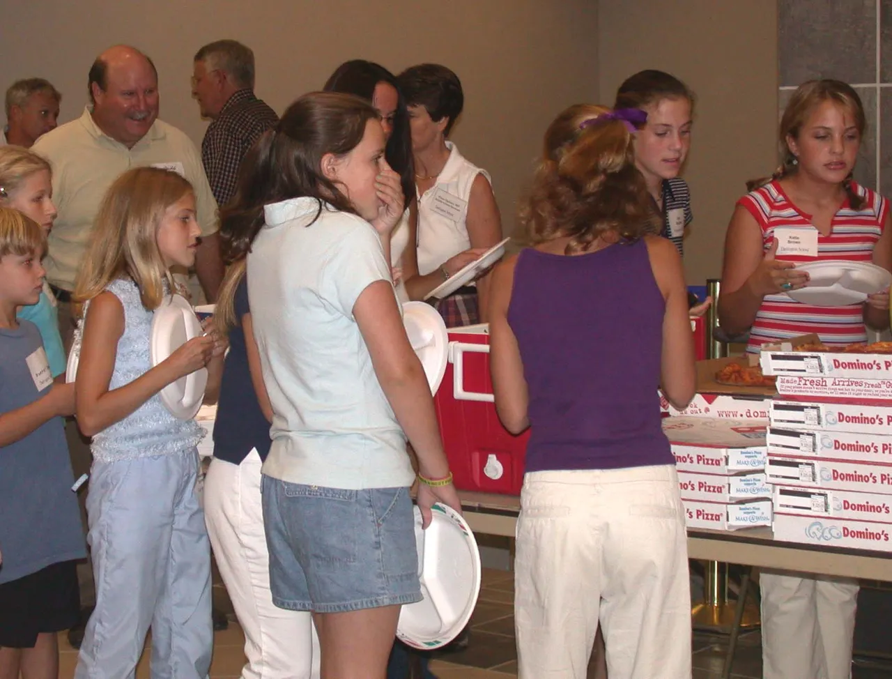 Pizza and friends just seem to go together at the Middle School "Welcome to Darlington" pizza party.