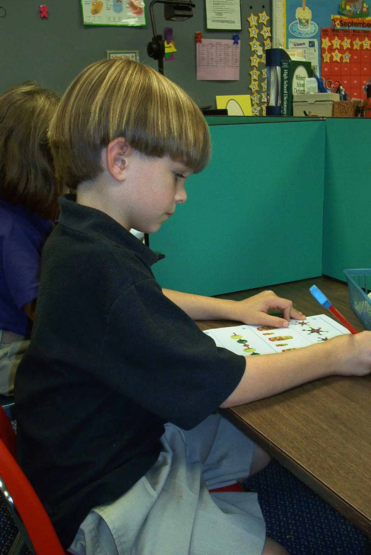 Bob Ledbetter, kindergarten, is a superstar as he works on a math lesson.