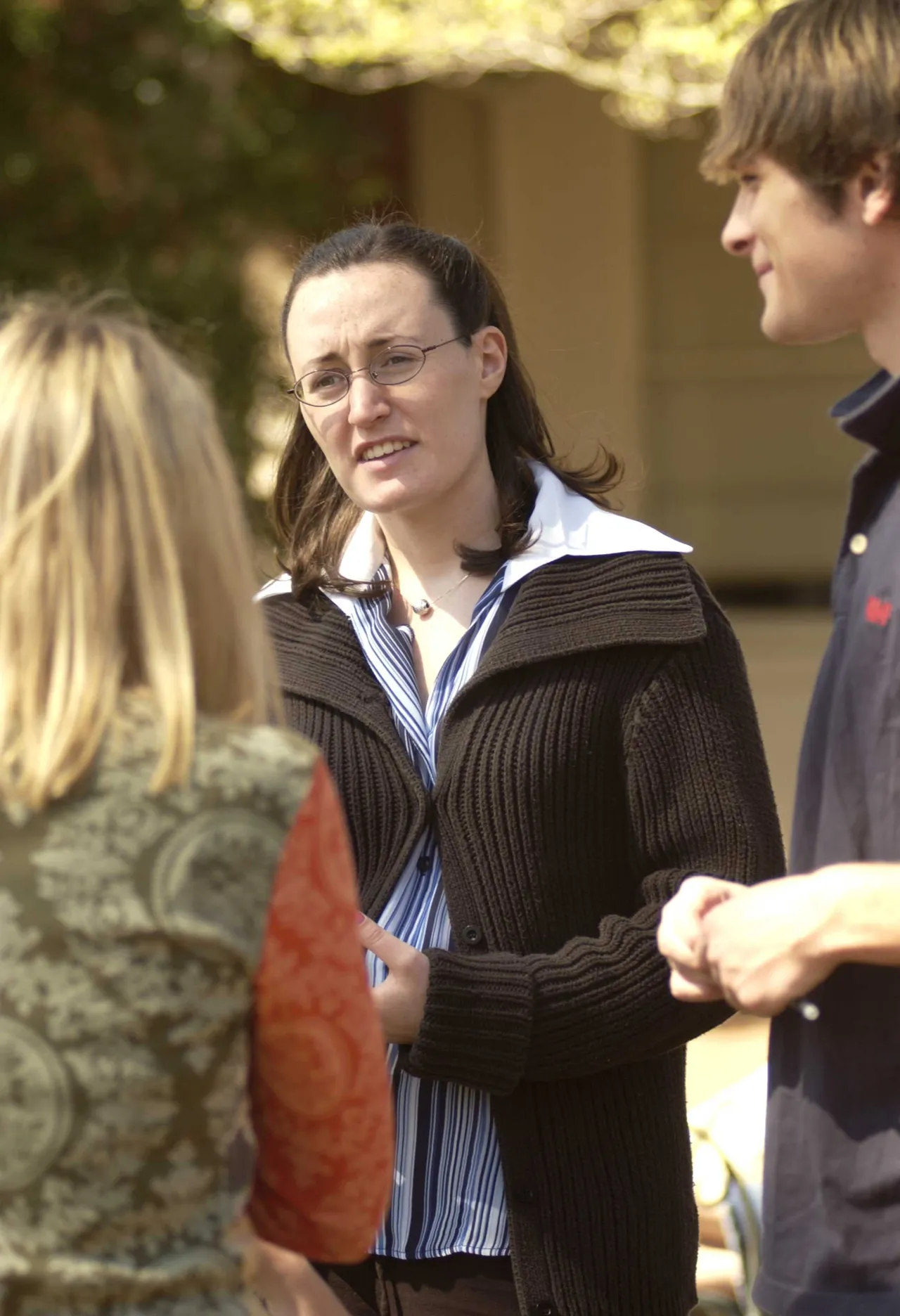 Upper School English teacher Stephanie Chastain talks with students about war concerns.