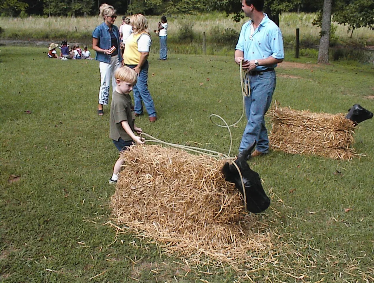 Thomas Jackson, pre-kindergarten, ropes a steer.