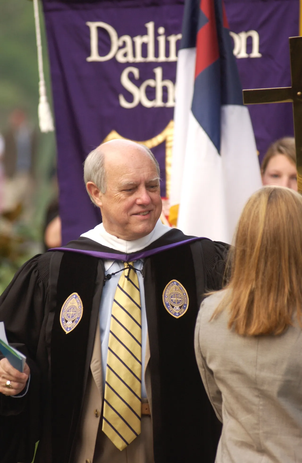 Sam Moss, associate headmaster and dean of college guidance, talks with student body president Anne Montgomery.
