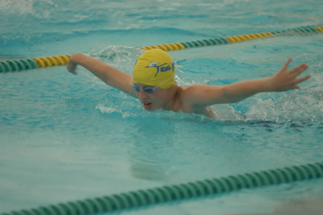 Kristopher Bryant swims the 50-meter butterfly.