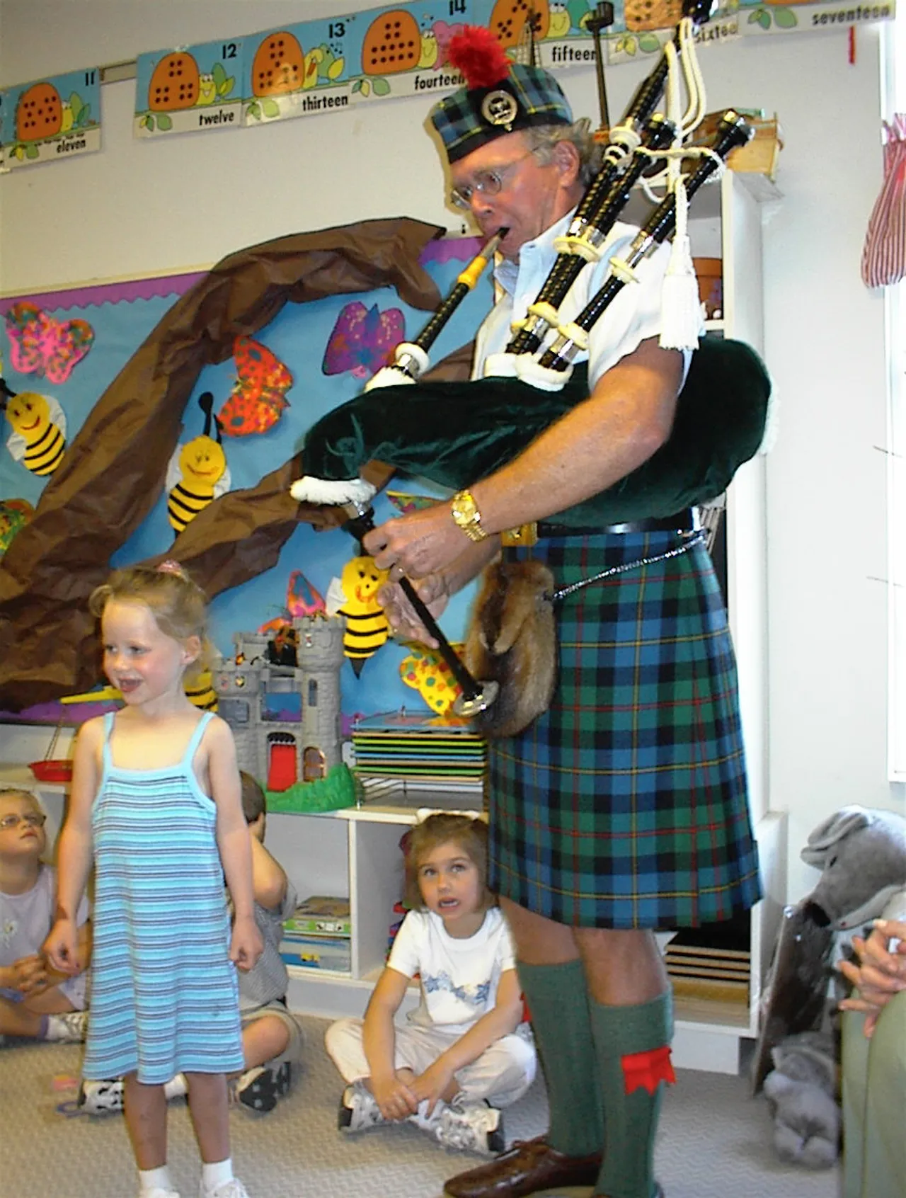 Darlington friend, Scott Macleod, explains the wonders of the bagpipe to mesmerized pre-kindergarteners as part of their studies of the letters “W” and “B.”