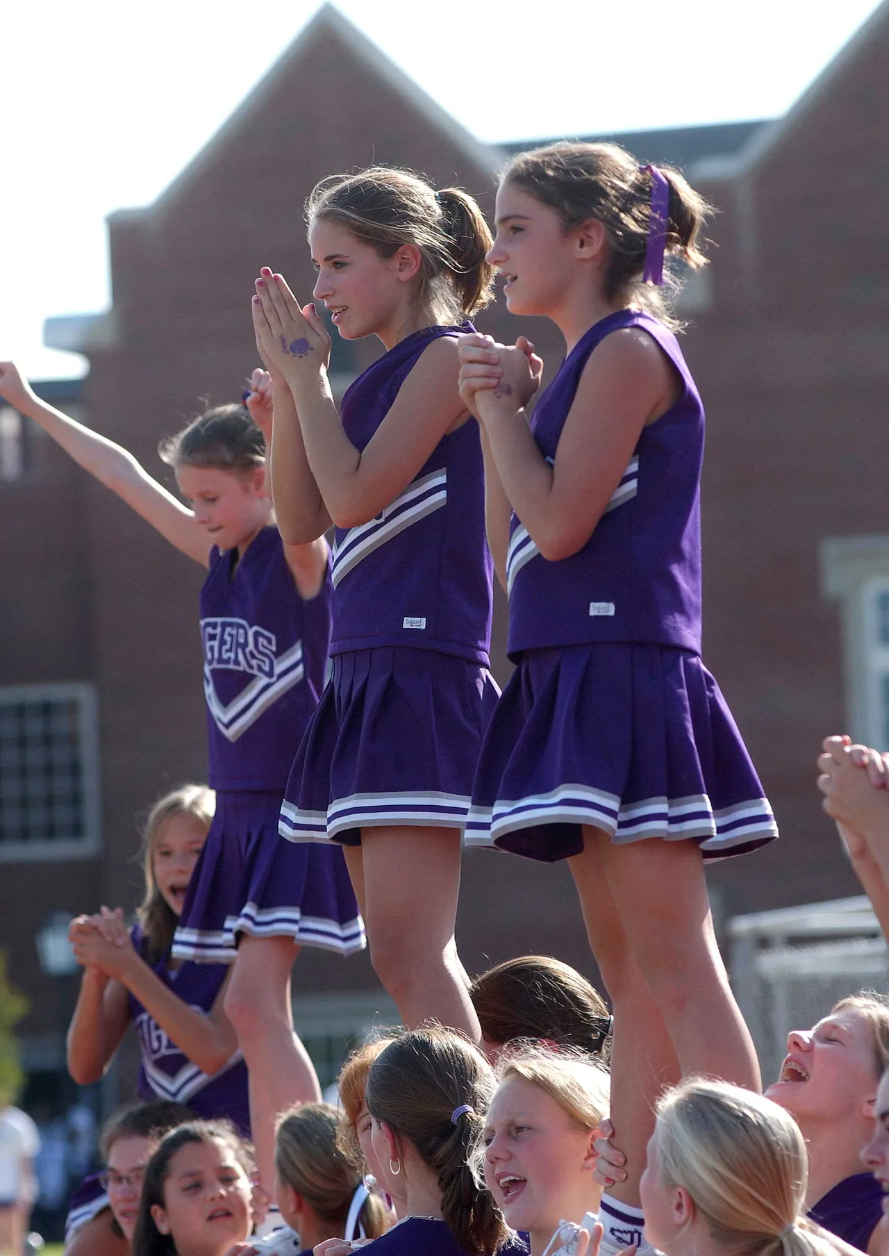 Middle School cheerleaders root for the Tigers.