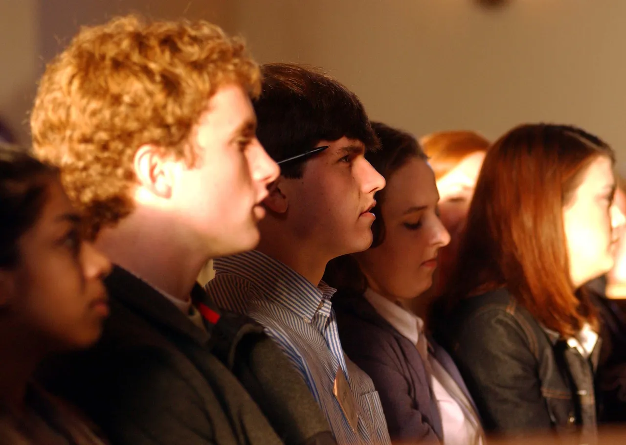 Students listen to Busby explain six skills they need to develop to be successful.