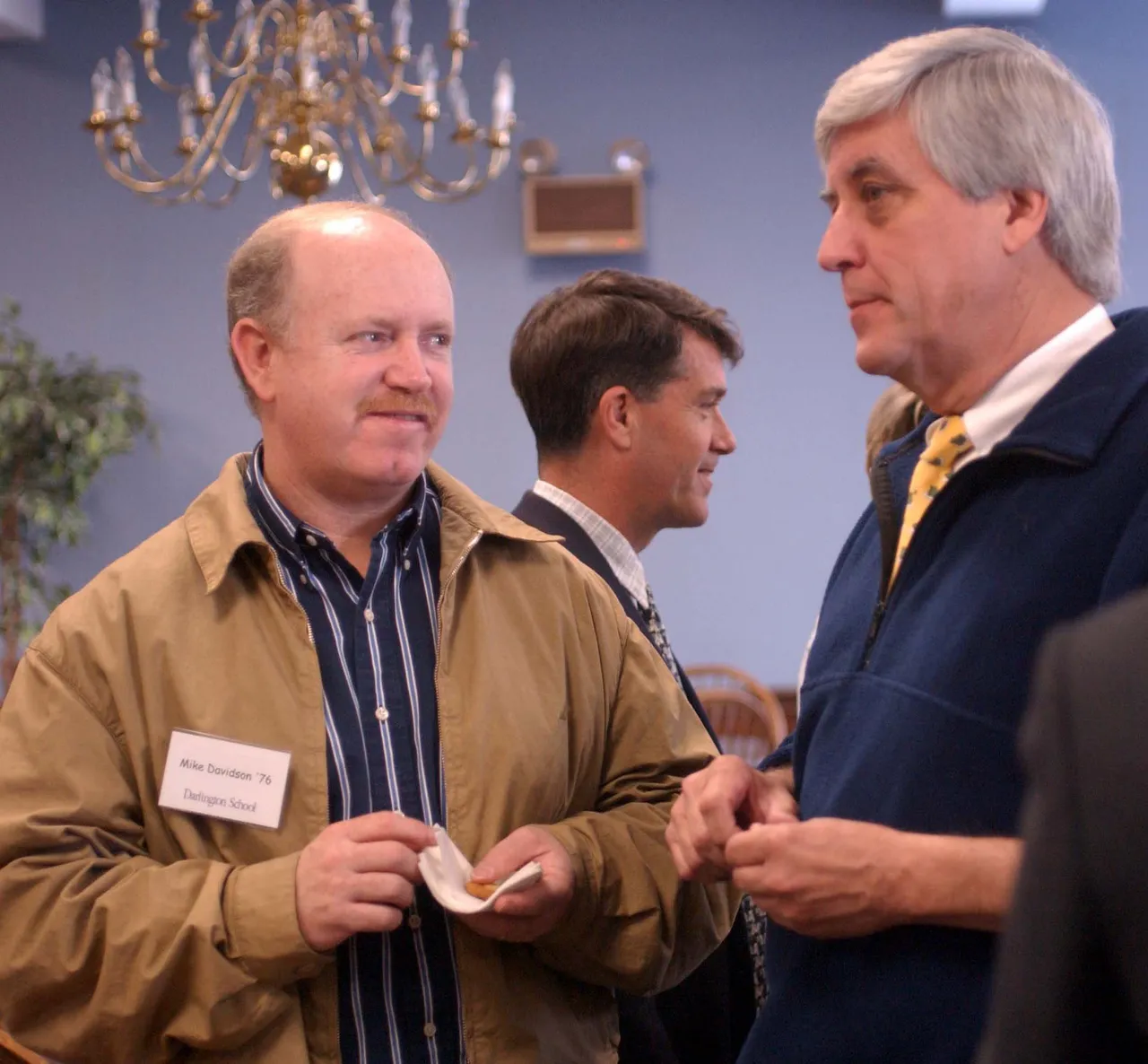 Mike Davidson '76 visits with Rick Buice, information technology and communication department chair, during a reception before talking with students about the field of sports.