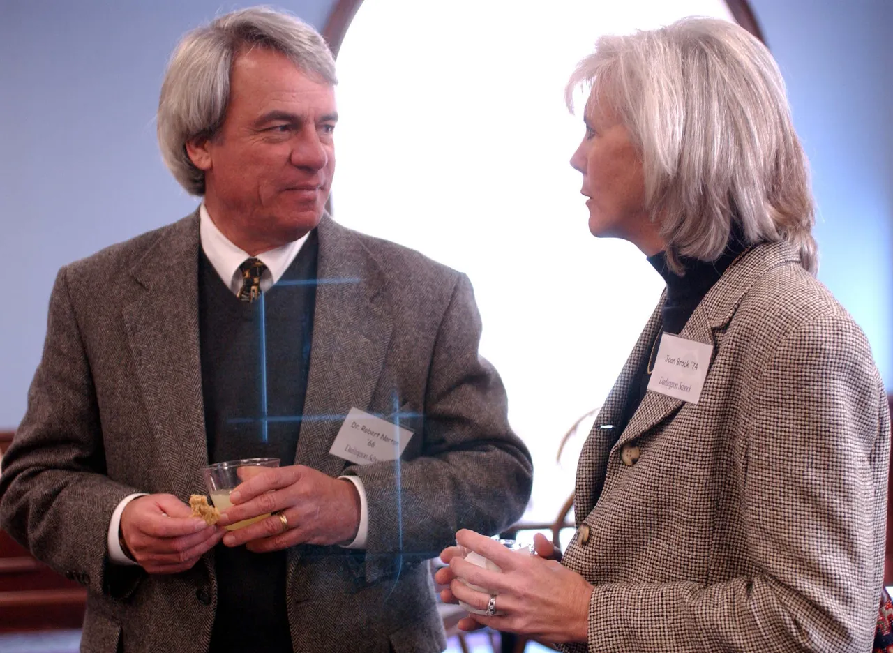 Bob Norton '66, psychologist, visits with Joan Brock '74, physical therapist, during a reception before presenting their fields to students.