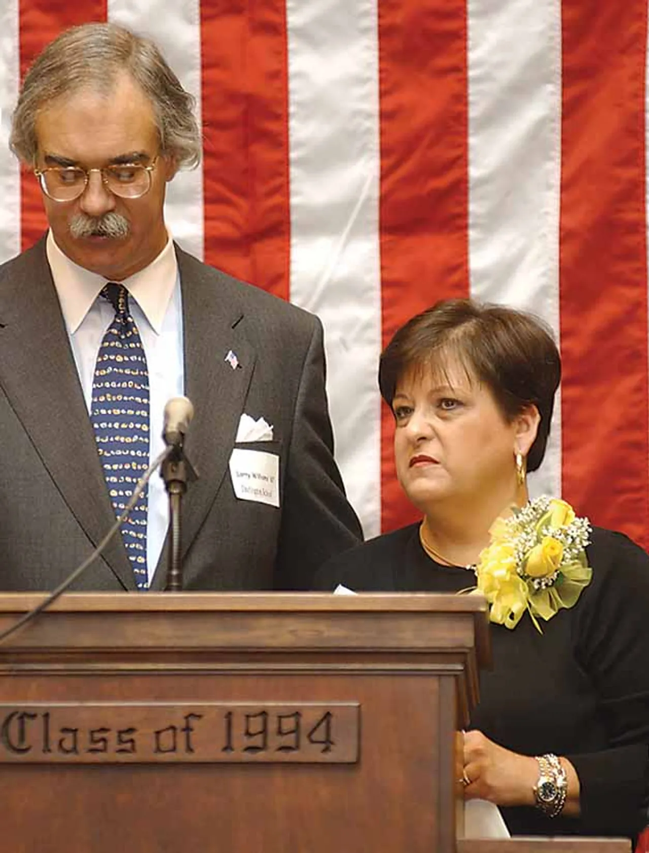 Larry Williams ’67 and Jackie Huffman McIntyre acquaint the audience with Butch Huffman.