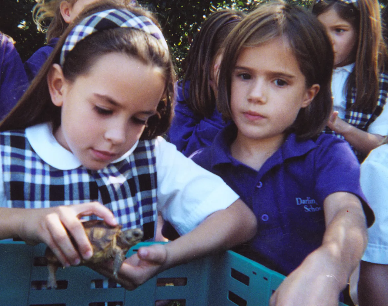 Anna Grace rutledge and Lizzy Gilbert learn about the gopher tortoise firsthand.