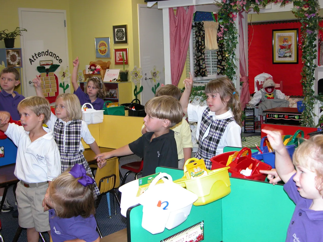 Kindergarten teacher Patricia Ayer's students practice making "Js" in the air.