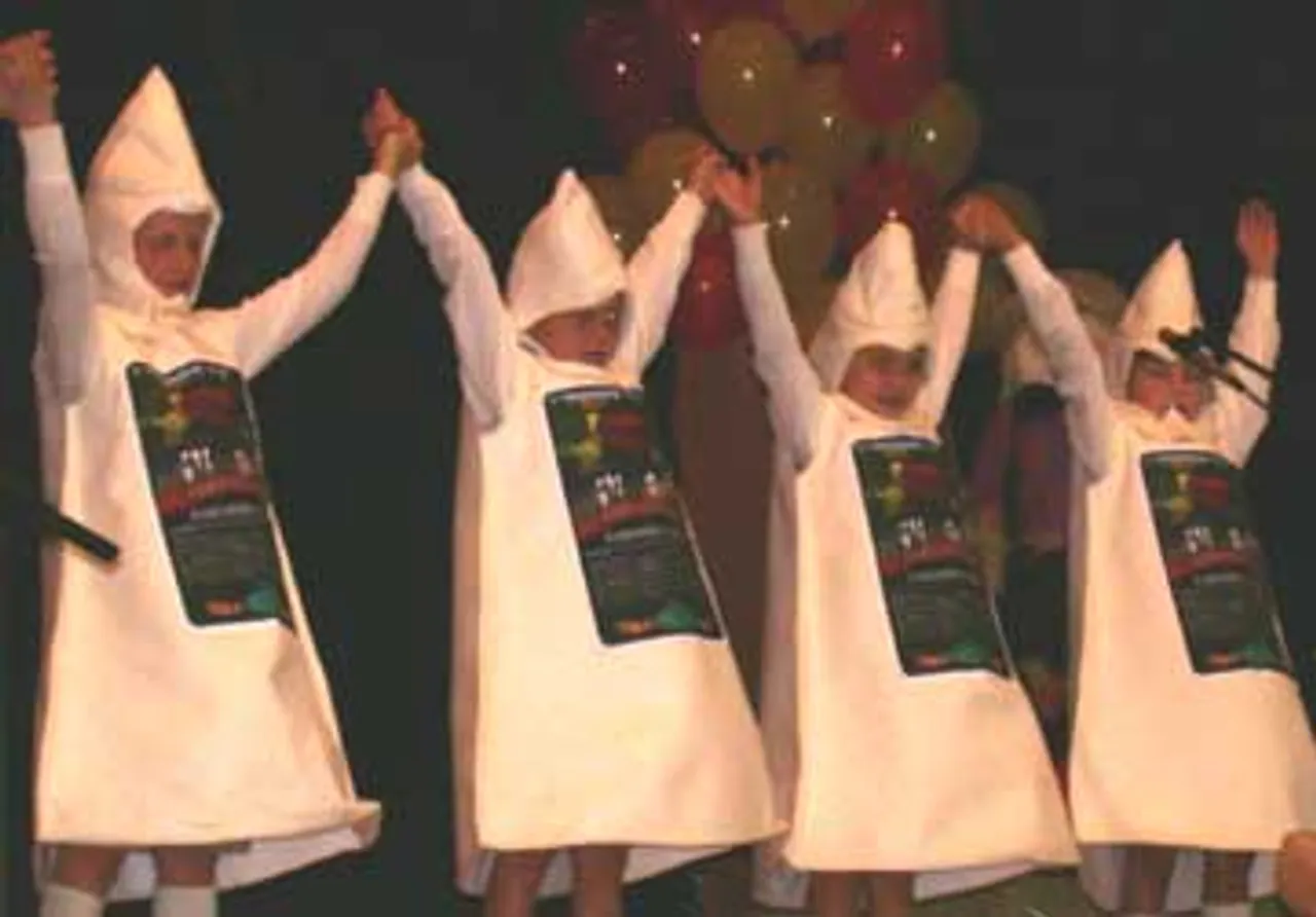 Second graders dressed as blocks of cheese receive a standing ovation.