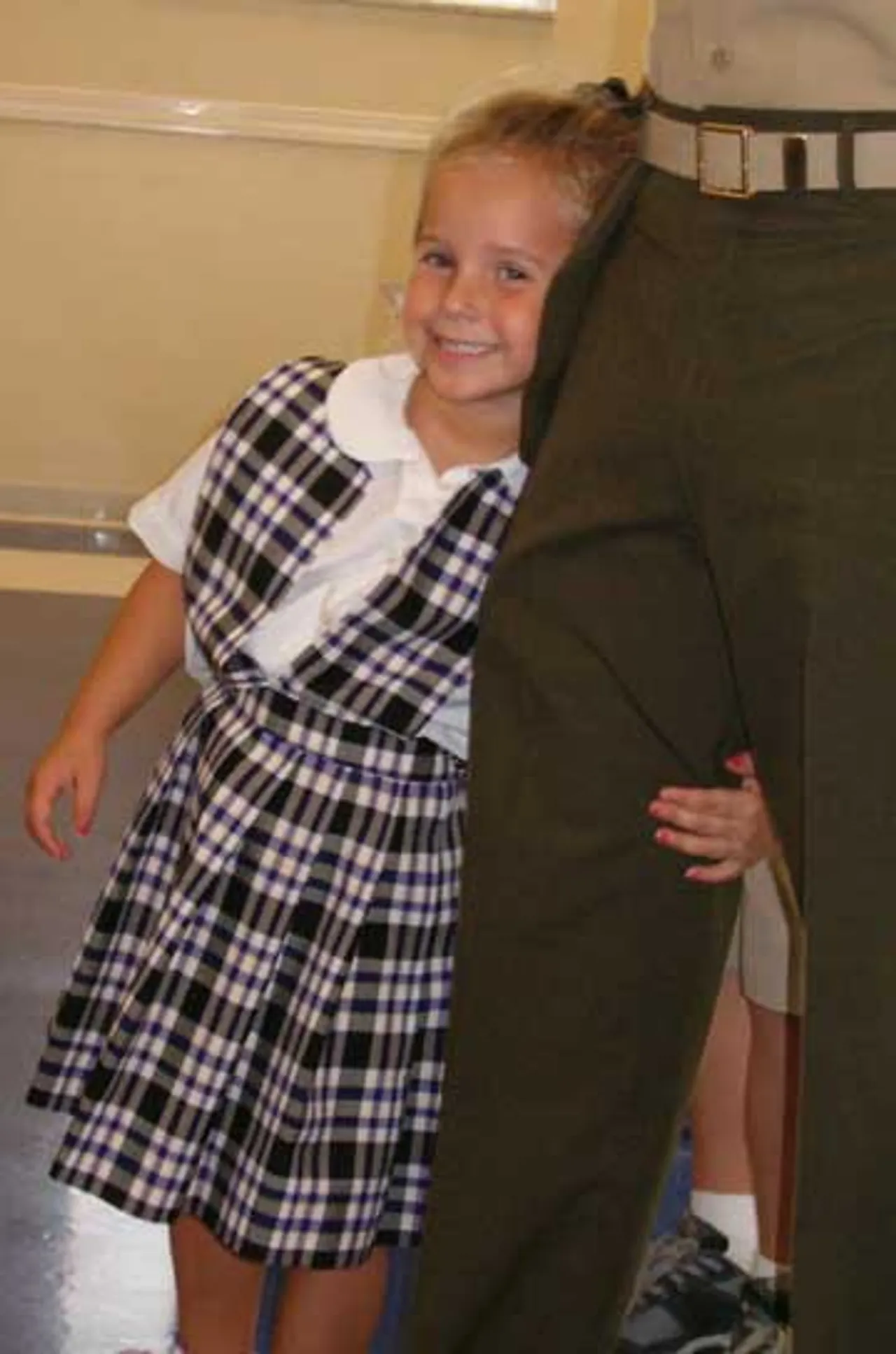 Callie Maffett, pre-kindergarten student, holds tightly onto her father Lt. Col. Lance Maffett, happy to have him home after a seven-month tour in Afghanistan.