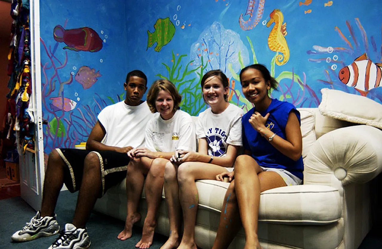 Mike Jones, Katie Binns, Kelly O'Mara, and Crystal Gadishaw-Lue enjoy their masterpiece.