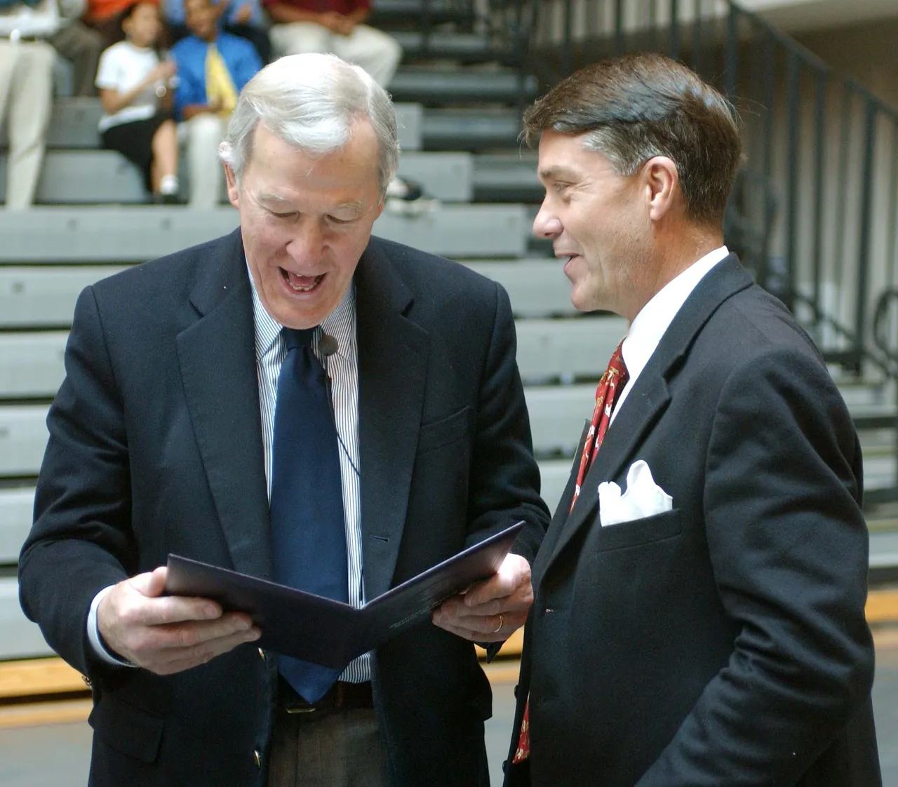 Darlington President David Hicks presents Roger Mudd with a diploma making him and honorary member of the Class of 1953, most of whom he taught or coached his one year at Darlington.